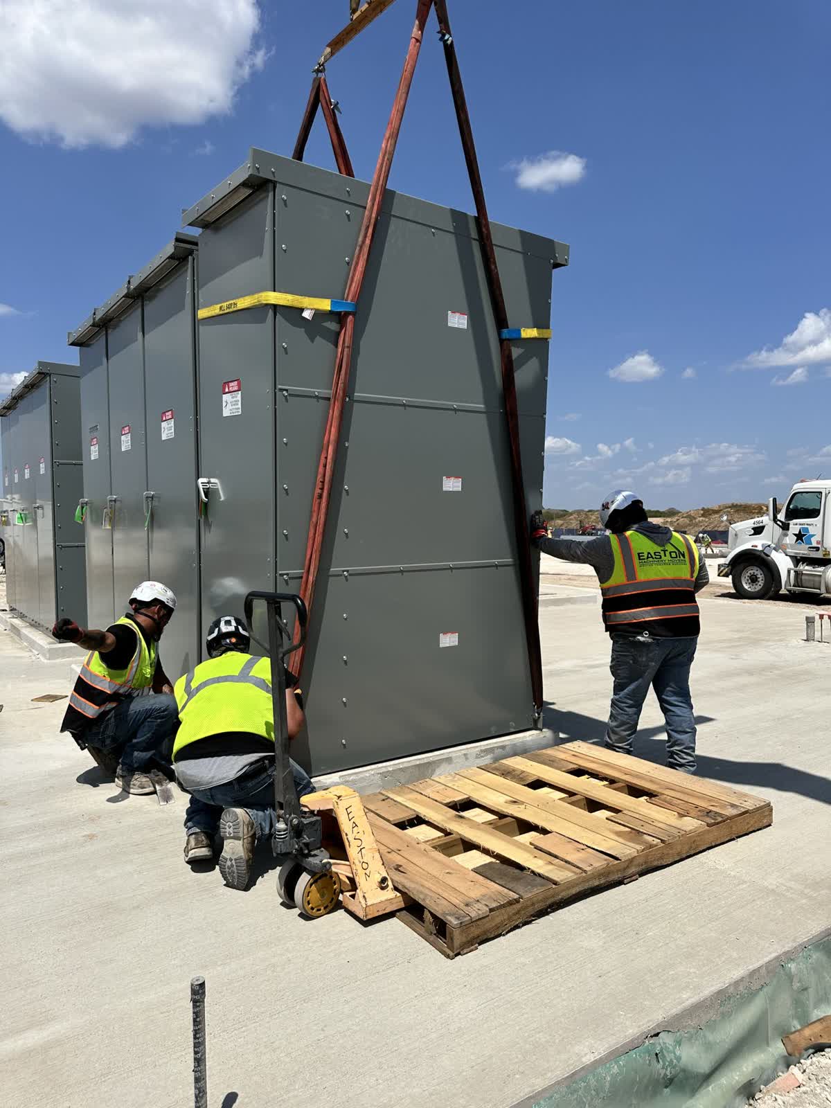 ATS units being set on a pad for an electrical company