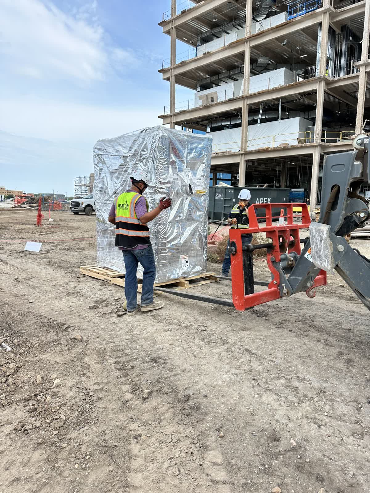 Easton crew member setting a wrapped machine on a San Antonio job
