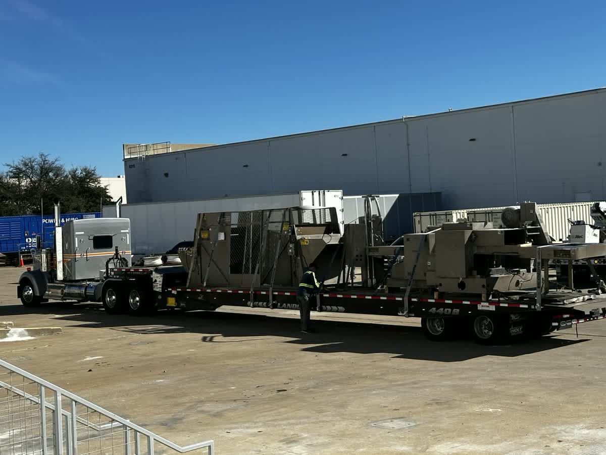Stainless production line loaded on a flatbed for transport