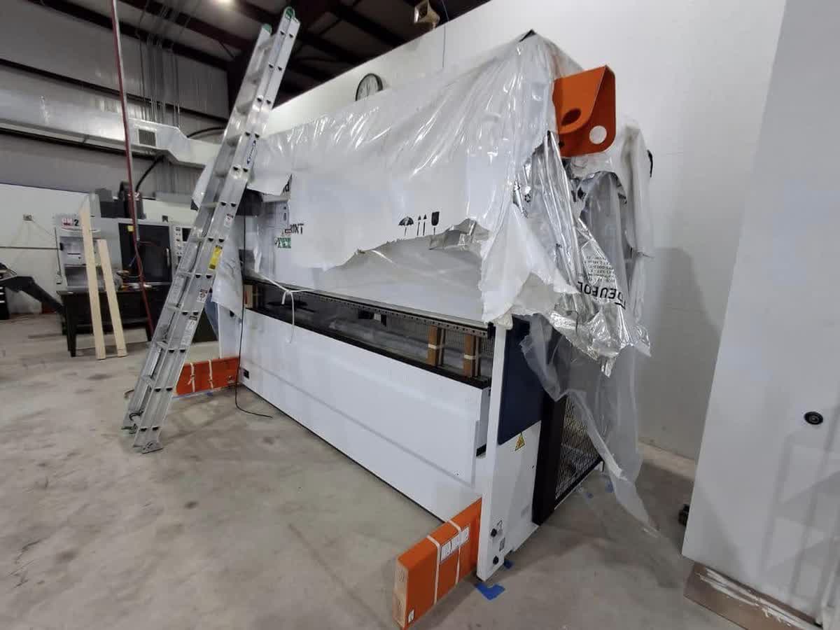 Heavy machine moved on skates through a tight shop bay